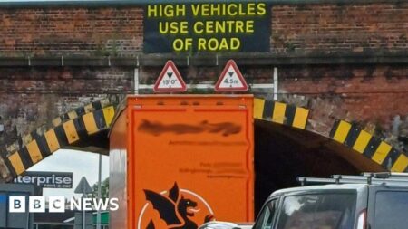 Digger ‘hits traffic light’ and crashes into Post Office in Wigan – BBC