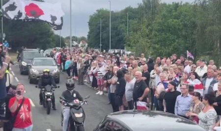Hundreds of protesters gather at asylum hotel in Norwich area – BBC