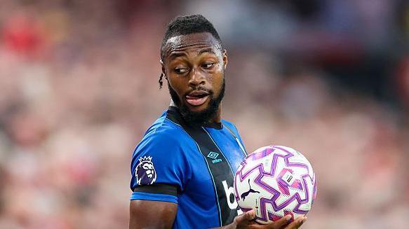 Man arrested after Bournemouth player reports racial abuse at Liverpool match – The Guardian