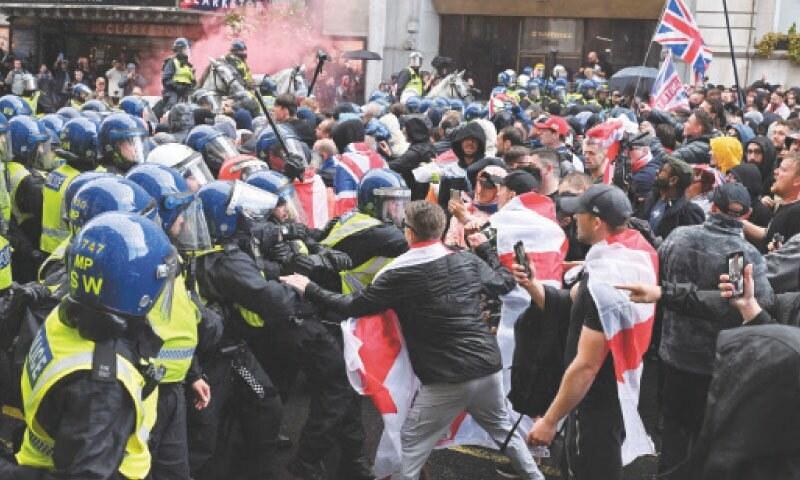Protesters clash with counter group at anti-immigration march – BBC